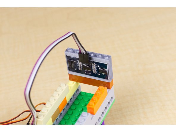 If you do not have access to a 3D printer, you can fashion a way of holding the sensor in place using some LEGO pieces, tape, rubber bands, zip ties, or some other method. The important thing is that it should point towards where the robot is going when it is moving forward.