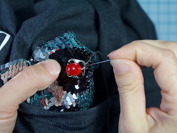 Thread your needle with conductive thread.