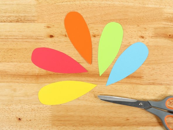 You can cut the feathers out of colored cardstock, colored construction paper or white paper and color your own.