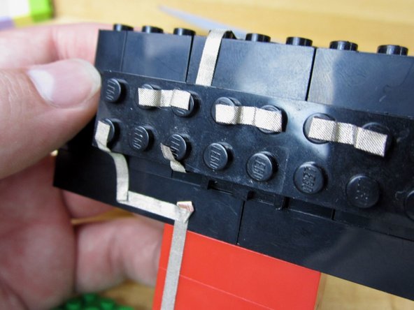 Run a line of tape from the 2nd LED back around the LED holder.