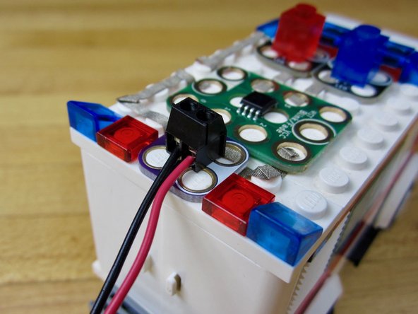Use a screw driver to attach the wires from the 2 AAA Holder to the Screw Terminal Chip.
