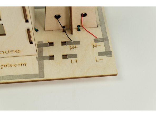 We're going to connect the red wire to  M+ and the black wire to M-