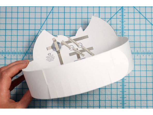 Interlock the slits in two places to create the size that works for your head. 