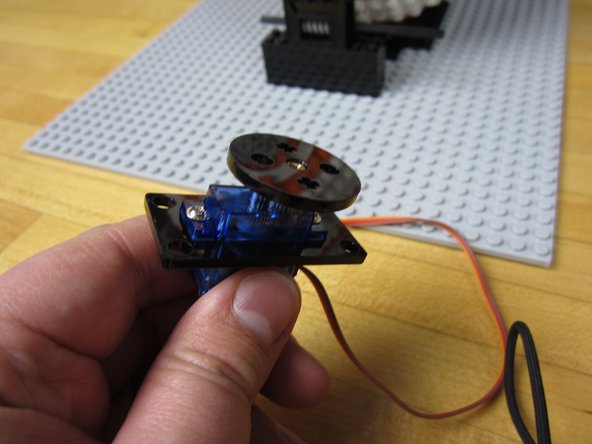 We're using a 9G sized Continuous Rotation Servo with metal gearing, connected to LEGO using our Crazy Circuits adaptors. (Laser cut and open source!)