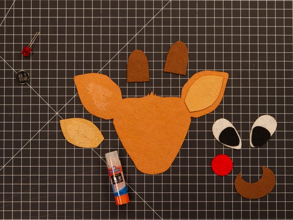 The glue stick takes a while to dry, so once you stick it down be careful not to let the felt piece move around. (You could help them stay in place with a few small pieces of blue painter's tape.)