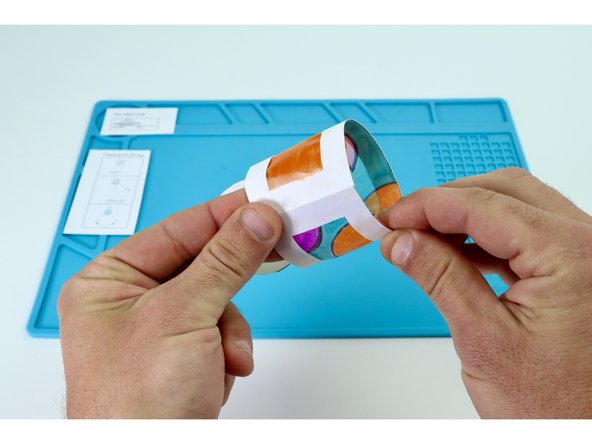 Use another couple of smaller tape pieces to close the lid.