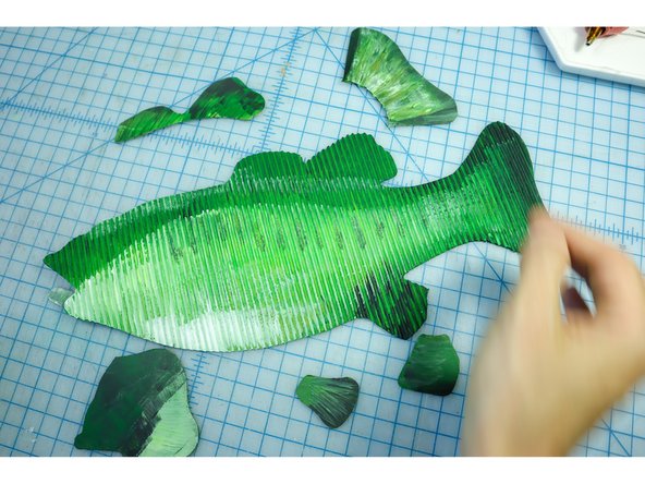Paint the fish with acrylic paint. I found that using neon green paint looked great to make it really pop!