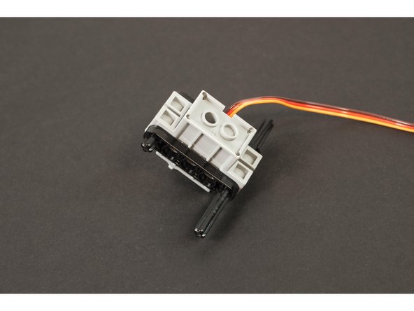 Next, slide the two LEGO Beam 5 x 0.5 with Axle Holes on each end (11478 / 44864) parts into place on the axles.