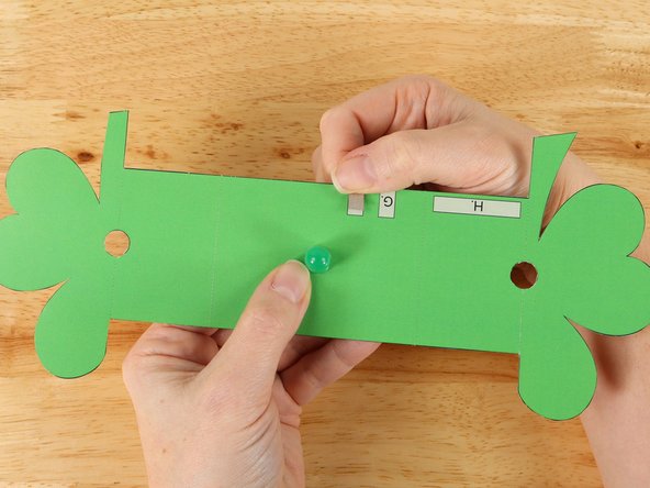 Add Maker Tape to tape path F.  This piece of Maker Tape will overlap with the right end of tape path C and wrap around the bottom of the project to the front side.