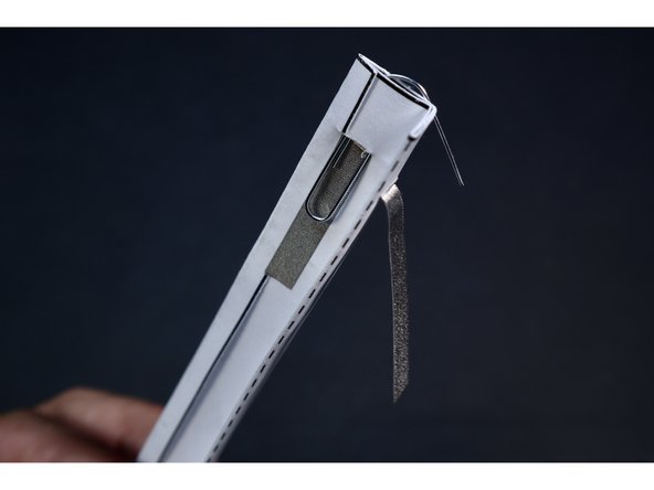 Note: your battery will eventually be seated within the fold so that it sits between the two conductive paths you have created. On one side of the battery, there will be Maker tape and a paperclip. On the other side of the battery there will be just Maker Tape.