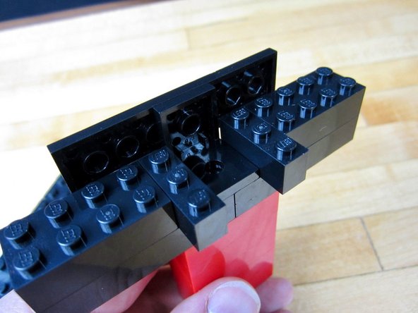 Use standard bricks to build the tower that holds everything.