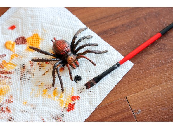 Tie the other end of the string to a toy spider.