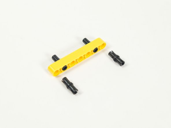 Add two more black pins on the opposite side.