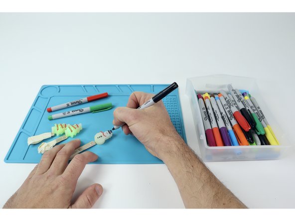 Most Molded LEDs when popped out of their molds will have tiny recessed details that may be hard to see.  Add a little extra flair by coloring those areas in with fine tipped permanent markers.