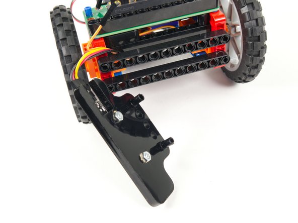 Use two pins to connect the NeoPixel Strip to the front of the Rover.