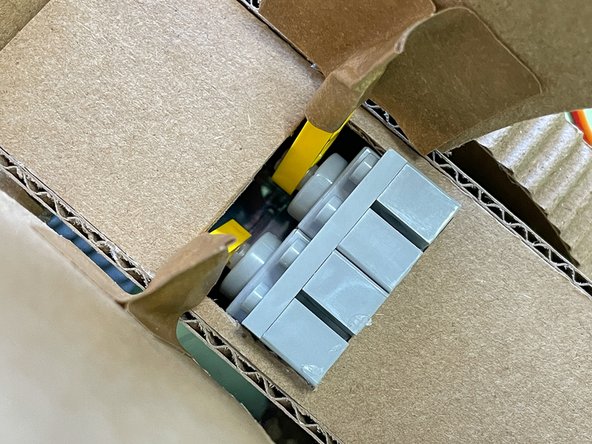 Glue two servos inside the rectangle as shown.