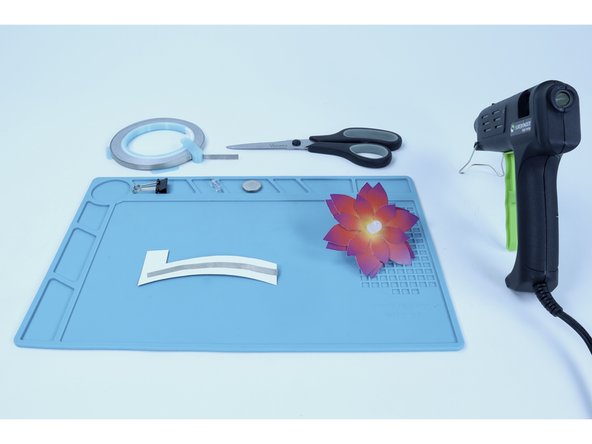 Flip your project over. Peel and stick that new tape segment where shown in the second photo.