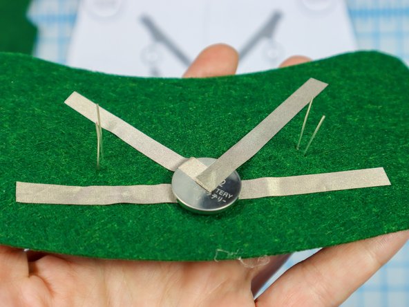 Insert each LED through the holes with the longer, positive leg in the top hole.