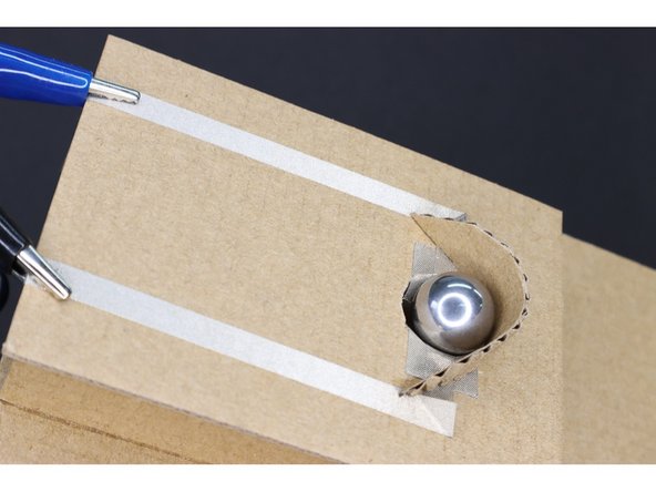 Lay the pieces so the non-sticky part is over the hole, three on each side. The pieces should overlap slightly as well.