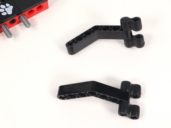 Attach a rubber gripper to each end of the axle on both grippers as pictured. These can be adjusted when using depending on what you are trying to grab.