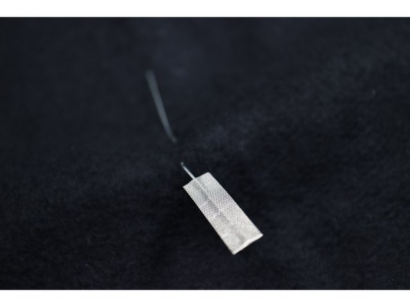 Make the LED legs easier to connect by wrapping about 1 inch of Maker Tape around each leg as shown.