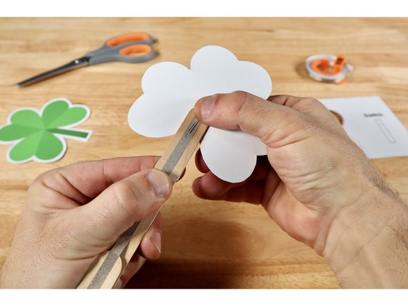 Flip the developing project over. Now bend the remaining long Positive (+) LED Leg over the top of the wand handle to the opposite side so that it's in line with and above the uninterrupted end-to-end path.