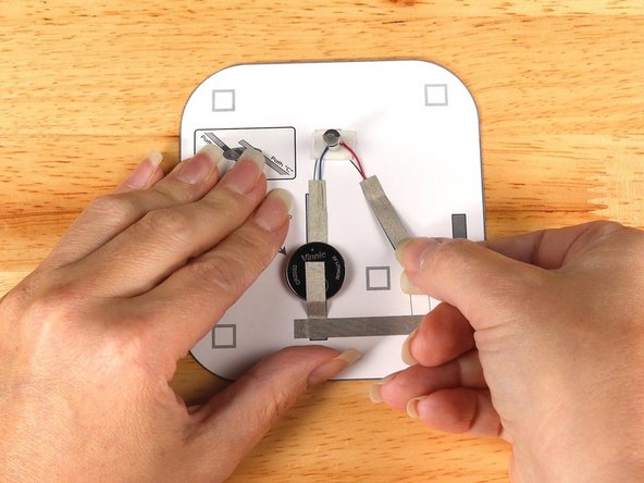 Add tape Path E. pressing it down atop the red wire.