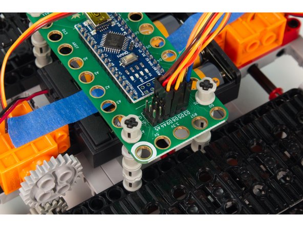 For the servo connectors the orange wire is the signal wire, and goes into the labeled pin. (For the Front Servo that is Pin D6, and for the Rear Servo it is D9.) The red wire then goes to the 5V row, and the brown wire goes to the GND row.