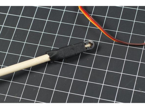 We attached our mallet to a small LEGO beam with some tape. We found this worked well because it wasn't too rigid, and allowed the mallet mechanism to flex a bit when it hits the bars.