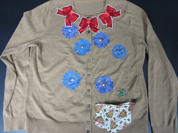 At this point you can just sew on all the fabric embellishments you want as long as your'e using regular thread.