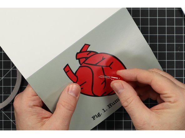 Insert the LED legs through the front of the card.