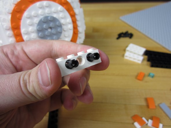 Remove all the extra parts on the bottom of your BB-8. You want to leave the bottom white area completely flat.