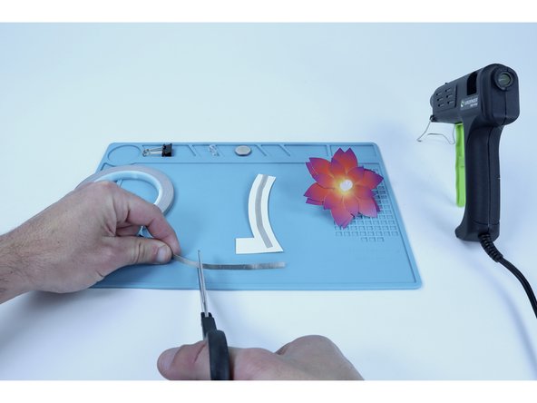 Measure and cut a new Maker Tape segment roughly 2x the length of the tab (a little extra is fine).