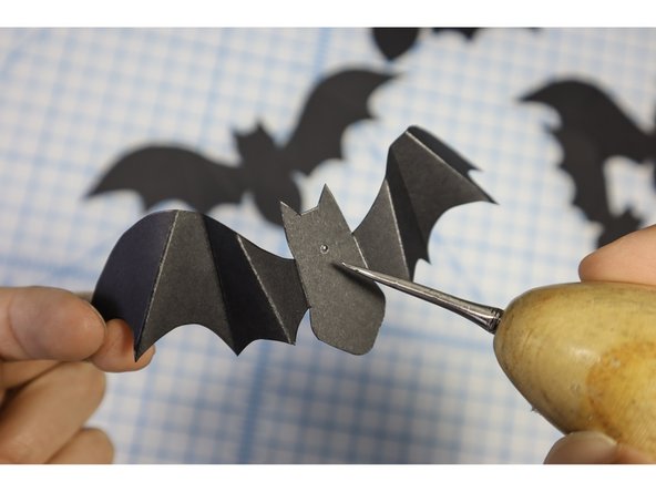 Make a hole in each bat where indicated.