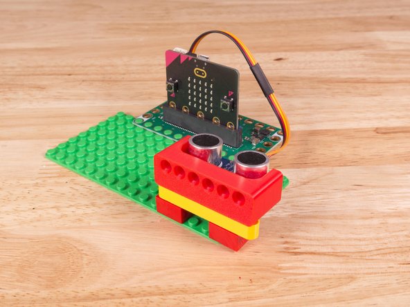 A few Technic pins, a Technic beam, and some LEGO bricks are all that is needed.