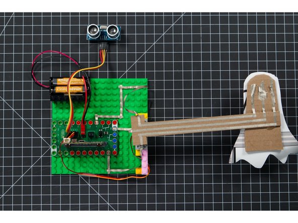 With the arm attached do a bit of testing to make sure  that it moves from the down position to the up position when the sensor is triggered.