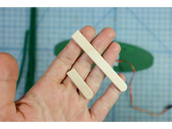 Trim the popsicle stick so that it is 3 inches long.
