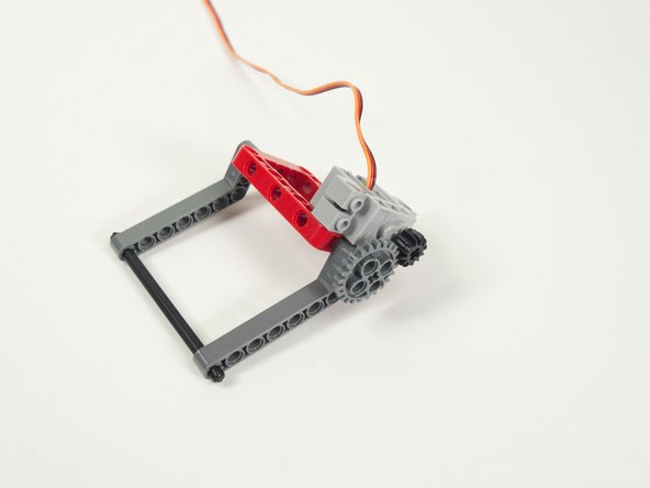 Make sure the gear is lined up and centered with the smaller gear that is on the servo.