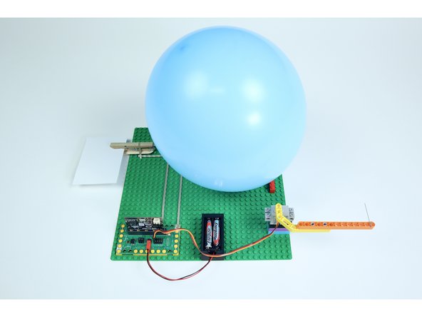 Reconnect the battery. Afterward, secure the device out of sight with tape on a table or wall.