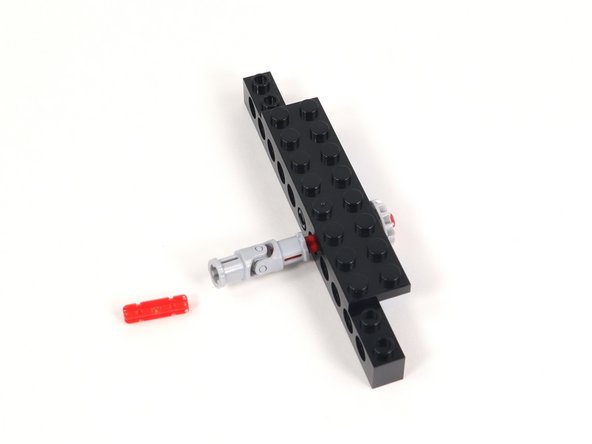 Insert a 2-stud long axle into the other end of the universal joint.