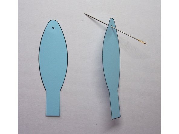 Use a needle to poke holes in the ears where indicated on the template