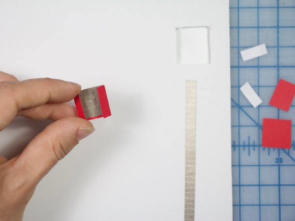 Cut small pieces of Maker Tape to cover the inside of the flap as shown.