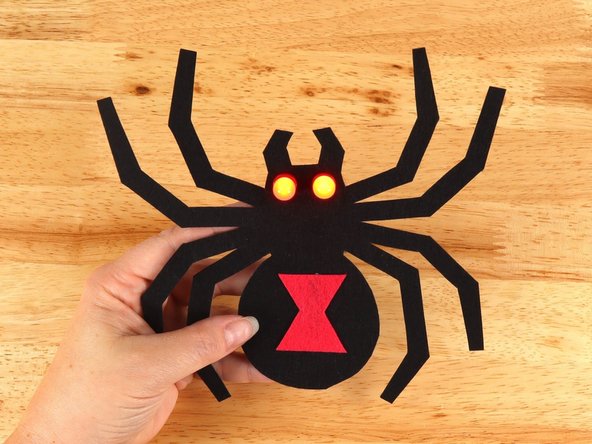 Add Maker Tape to connect the top (Positive) side of the battery to the Positive LED legs path above.