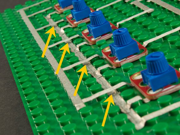 Where the tape might need to cross over another piece of tape, you’ll need to run it in the gutter between the studs so it doesn’t connect to the tape running on top of the studs.