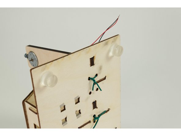 After the windmill is in place twist the wire together to hold it down against the base.