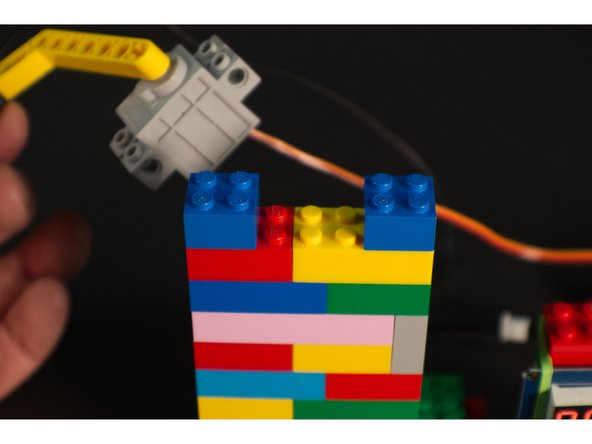 We needed to mount our servo at the proper height so it could lower the thermistor into our mug. This is easy to do with, you guessed it, LEGO bricks!