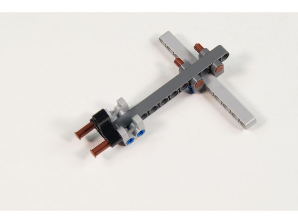 Make sure the axles are only part way through so we can add more parts in the next step!