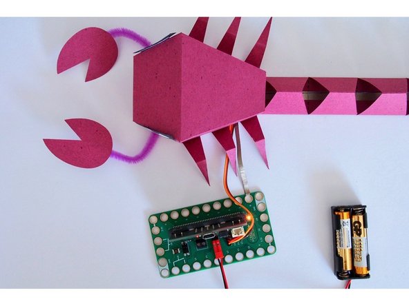 We looped the Maker Tape around the holes in the Bit Board, like in Step 4 of this project.