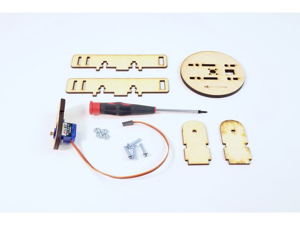 Gather the wooden parts shown and four (8-32-3/4”) screws/nuts.
