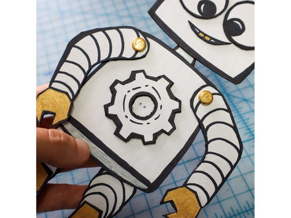 Make two holes in the center of the body where you would like the LED to go.